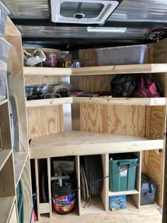 the inside of a truck with shelves and other items in it's storage area