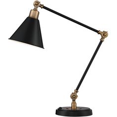 a black and gold desk lamp on a white background, with the light turned off