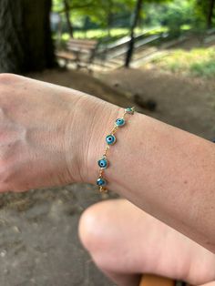 Our light blue evil eye bracelet is dainty and waterproof, perfect for everyday wear! Information: 🧿 18K Gold Filled 🧿 Dainty | each eye is around 5-6MM 🧿 Length: 7" | extensions available upon request 🧿 Hypoallergenic 🧿 Tarnish resistant 🧿 Waterproof The Evil Eye 🧿 is known as a protection talisman, it said to protect the wearer against evil energies. Our Evil Eye bracelet is reversible, meaning that the eyes will always be visible. Each Evil Eye charm is unique. The eyes on our bracelet are light blue. They shimmer perfectly in the light and the color is so pretty! If you desire a longer or adjustable length, extensions are available upon request, just let me know. This makes a perfect gift. Blue Resizable Spiritual Evil Eye Bracelet, Turquoise Evil Eye Bracelet As Gift, Everyday Blue Bracelet With Adjustable Chain, Blue Adjustable Chain Bracelet For Everyday, Blue Hypoallergenic Evil Eye Bracelet As Gift, Hypoallergenic Blue Evil Eye Bracelet Gift, Blue Evil Eye Bracelet With Adjustable Chain, Blue Resizable Evil Eye Bracelet, Dainty Blue Round Evil Eye Bracelet