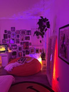 a bed room with a bean bag chair and pictures on the wall