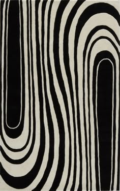 a black and white rug with wavy lines on it