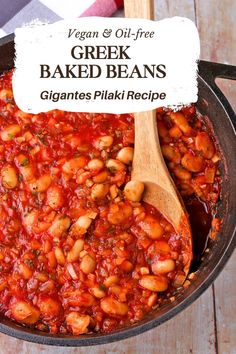 a pan filled with baked beans on top of a wooden table