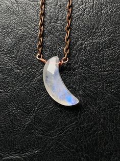 "Perfect minimalist piece for my moon goddess and child, celestial babes and witches. Petite faceted moonstone crescent moon packs quite a punch with its beautiful facets and flashy rainbows. It has been lovingly wrapped in solid copper wire onto a matching copper chain. This moon flashes, twinkles and shines so beautifully. Necklace closes with a lobster claw clasp. Necklace measures 18\" Pendant measures 1\" Moonstone is believed to develop inner growth and strength. It is believed to aide in Minimalist Moonstone Moon Jewelry, Minimalist Moon Phase Jewelry For Healing, Crescent Moonstone Jewelry For Healing, Minimalist Moonstone Jewelry For Healing, Dainty Wire Wrapped Moonstone Jewelry, Dainty Crescent Moonstone Jewelry, Dainty Handmade Half Moon Jewelry, Healing Crescent Moonstone Jewelry, Minimalist Moonstone Necklace With Moon Phase