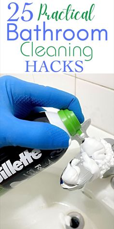 a person in blue gloves is cleaning a sink with toothpaste on it and the caption reads 25 practical bathroom cleaning hacks