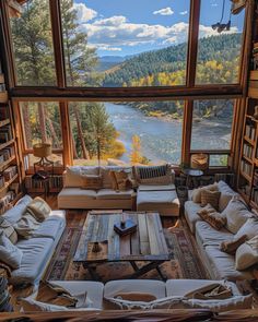 a living room filled with lots of furniture next to a large window covered in books