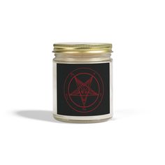 a glass jar with a pentagramil on the front and red ink in it