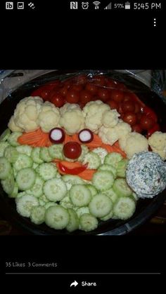 a platter filled with cauliflower, carrots and other vegetables