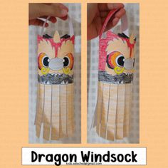 the dragon windsock is made out of paper and has an owl face on it