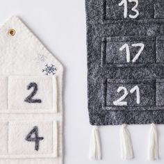 two felt house numbers are shown next to each other