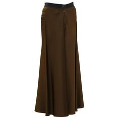 For Sale on 1stdibs - Early 2000's Gaultier brown maxi skirt. Horizontal quilting details on the hips with a pant style front button and zipper closure. The cotton waistband Elegant Brown Full-length Maxi Skirt, Elegant Brown Full Length Maxi Skirt, Fall Full Length Brown Maxi Skirt, Brown Full Length Maxi Skirt For Fall, Brown Full-length Maxi Skirt For Fall, Fitted Brown Lined Maxi Skirt, Brown Full-length Lined Skirt, Fitted Brown Maxi Skirt For Workwear, Brown Fitted Full Length Skirt