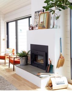 a living room filled with furniture and a fire place