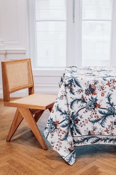 a chair and table covered with a floral print