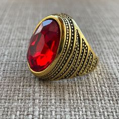 Gold Tone Rings Red Crystal Fashion Ring Men Ring Size 7.5 Unbranded Color: Gold, Red Size: 7.5 Brand New. Never Used. Fashion Jewelry Red Metal Ring Jewelry For Anniversary, Classic Adjustable Red Ring, Vintage Adjustable Red Ruby Ring, Adjustable Red Oval Ruby Ring, Adjustable Vintage Ruby Ring, Adjustable Oval Red Ruby Ring, Classic Red Crystal Ring As A Gift, Classic Red Crystal Ring Gift, Classic Red Crystal Ring For Gift