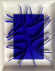 an abstract blue artwork in a white frame