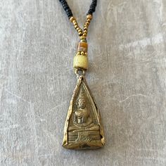 This one-of-a-kind vintage brass Buddha pendant has a unique beaded necklace. M Hand strung on 7 strand wire with a lobster clasp. This necklace hangs 11 inches from clasp to bottom of pendant. Adjustable Beaded Necklace With Teardrop Pendant, Artisan Necklace With Adjustable Gold Beads, Handmade Antique Gold Medallion Necklace, Handmade Bohemian Beaded Necklace With Teardrop Pendant, Handmade Adjustable Beaded Necklace With Teardrop Pendant, Vintage Style Dangling Beads For Gift, Handmade Adjustable Teardrop Pendant Beaded Necklaces, Handmade Adjustable Teardrop Pendant Beaded Necklace, Bohemian Adjustable Beaded Necklace With Teardrop Pendant