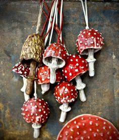 small red and white mushrooms hanging from strings