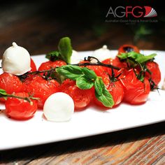 tomatoes and mozzarella on a white plate