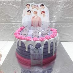 a birthday cake decorated with photos and hearts