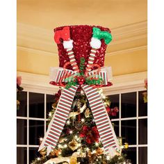 a decorated christmas tree with stockings on it