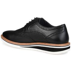 A dress shoe that combines high-style with all-day comfort, the Warrick by Vance Co. A wingtip accent and a contrasting textured design enhanced with brogue details tops this lace-up derby. Smooth vegan leather, a lightweight EVA outsole, and a 4 mm memory foam footbed provide superior support. Black Wingtip Oxfords For Spring, Black Wingtip Dress Shoes With Contrast Sole, Casual Black Dress Shoes With Brogue Detailing, Black Oxfords With Contrast Sole For Spring, Black Lace-up Oxfords For Semi-formal Occasions, Black Wingtip Oxfords For Business Casual, Black Cushioned Oxfords For Business Casual, Black Oxfords With Cushioned Footbed For Business Casual, Casual Fitted Black Dress Shoes