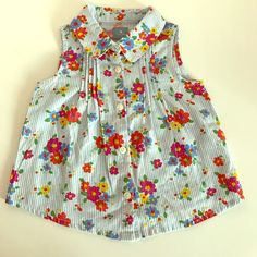 Baby Gap Floral Button Sleeveless Blouse. Tags Removed, But Never Worn! Multicolor Sleeveless Top With Buttons, Cute Sleeveless Blouse With Floral Print, Sleeveless Cotton Tops For Playtime, Playful Sleeveless Tops For Playdate, Cute Sleeveless Buttoned Tops, Spring Playwear Tops With Buttons, Summer Buttoned Playwear Tops, Summer Buttoned Tops By Gap, Summer Buttons Playwear Tops