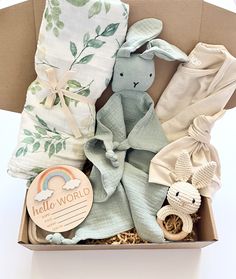 a baby gift box filled with blankets and toys