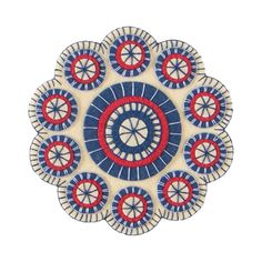 a blue, red and white circular design on a white surface with circles in the center