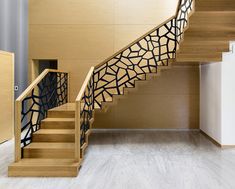 a wooden staircase with black and white designs on it