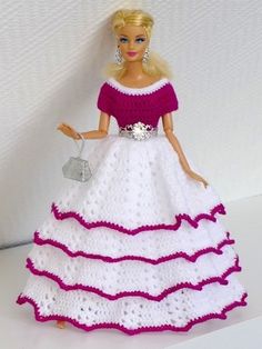 a barbie doll dressed in a white and pink dress