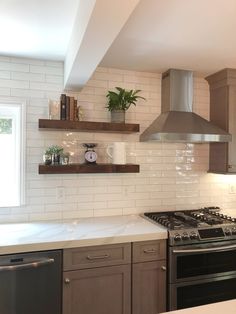 a stove top oven sitting inside of a kitchen