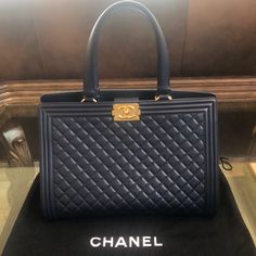 Authentic Chanel Boy Quilted Maxi Tote W/ Gold Hardware Navy Blue Color Calfskin. 14”W X 6 1/2” Depth X 9”H X 18”With Handle Height. Only Worn 3 Times Excellent Condition No Scratches Or Signs Of Wear Practically Brand New. Meticulously Cared For Statement Bag. Comes With Original Dust Bag And Authenticity Card. This Was A Limited Edition Bag One Of A Kind. Designer Blue Satchel For Business, Luxury Blue Bags For Business, Designer Blue Satchel For Formal Occasions, Luxury Blue Business Bags, Blue Shoulder Bag For Everyday Luxury, Luxe Top Handle Bag With Dust Bag, Luxury Blue Satchel For Formal Occasions, Designer Blue Satchel For Evening, Luxury Blue Shoulder Bag For Formal Occasions