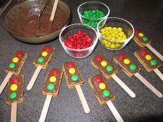 some candy sticks and bowls on a table