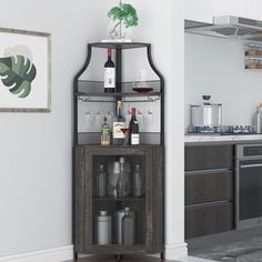 a corner cabinet with bottles and glasses on it