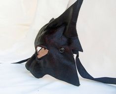 CAT MASK IN DARK LEATHER This item is available to order. Please allow three weeks before shipping. Our masks are made entirely by hand, all in genuine leather and wearable. The masks are designed not only as art objects, but also to be worn. Thanks to our special process the leather retains its elasticity allowing a good fit of the mask. The leather we luse is tanned using vegetable products. The casts of which are shaped masks are in clay and its are designed and produced by us. Thanks a lot f Handmade Fantasy Masks And Prosthetics For Costume, Fantasy Costume Mask For Cosplay, Medieval Masks And Prosthetics For Halloween Cosplay, Medieval Masks And Prosthetics For Cosplay And Halloween, Black Fantasy Costume Accessories For Larp, Handmade Gothic Masks And Prosthetics For Costume, Handmade Fantasy Masks And Prosthetics For Costume Party, Fitted Masks And Prosthetics For Cosplay, Fitted Masks And Prosthetics For Cosplay Events