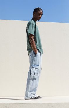 Dive into laid-back style with PacSun's Light Indigo Baggy Cargo Jeans. Crafted from light indigo denim, these jeans feature a zipfly closure, side and back pockets, and large cargo pockets with button closures and a woven PacSun tag for added flair. With a classic relaxed fit that's comfortably baggy, these jeans embody casual cool with a timeless appeal. Streetwear Washed Blue Cargo Jeans With Pockets, Baggy Washed Denim Blue Cargo Jeans, Baggy Faded Cotton Cargo Jeans, Baggy Jeans Outfit Men, Blue Cargo Pants Outfit, Denim Cargos Men, Graphic Jeans, Pacsun Outfits, Blue Baggy Jeans Men’s Outfit