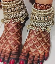 the feet are decorated with gold and pearls