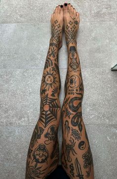 a person with many tattoos on their legs