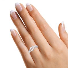 This exquisite 1/10 Carat Round White Diamond Bypass Heart Promise Ring is crafted with the finest 14k gold over sterling silver and features 0.10 cttw of shimmering diamonds of I-J Color and I2-I3 clarity. Perfectly capturing the spirit of love, this luxury ring promises a lifetime of commitment and elegance. 0.10 Carat White Natural Diamond Stone Setting : Prong Setting Model No : CSR-140120208 Classic White Heart Promise Ring, White Diamond Promise Ring Hallmarked, White Diamond Heart Ring With Vs Clarity, White Diamond Cut Heart Ring For Promise, White Heart Diamond Ring Vs Clarity, White Heart-shaped Diamond Ring With Vs Clarity, Heart Shaped White Diamond Ring With Vs Clarity, White Hallmarked Diamond Promise Ring, White Heart Ring With Diamond Cut For Promise