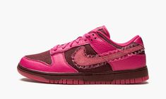 The Women’s Nike Dunk Low “Valentine’s Day” is a women’s-exclusive release of the classic sneaker in a unique colorway that pays homage to Valentine’s Day. A February 2022 release, the “Valentine’s Day” version of the Dunk Low succeeds popular Dunks that have shown love to the holiday before it, including StrangeLove Skateboards’ collaboration with the Nike SB Dunk in 2020. This “Valentine’s Day” Dunk features a maroon canvas base with pink tumbled leather overlays. A pink suede Swoosh can be fo Dark Fuschia, Nike X Travis Scott, Matching Colours, Low Air Jordan 1, Team Red, Dunks Nike, Nike Shox, Nike Sb Dunks, Nike Air Huarache