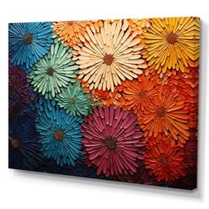 an abstract painting with colorful flowers painted on the canvas, it looks like they have been made out of wood