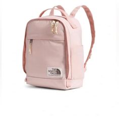 New With Tags, The North Face Berkeley Mini Backpack Color: Pink Moss/ Gravel Stylish Design. Designed With Our Outdoor Heritage In Mind, The Berkeley Mini Backpack Holds The Basics And Has A Vintage-Feel Fabric. A Water-Repellent Finish And Side Water Bottle Pockets Help Keep Your Valuables Dry And Body Hydrated. Comfortable Carry. This Stylish Bag Is Easy To Wear Anywhere And Features Crinkly Face Fabric With A Vintage Texture. A Padded Back Panel Makes Extended Wear Easy, While The Top Grab H White And Rose Gold North Face Backpack, The North Face Backpack For Back To School, Casual The North Face Backpack For Everyday, The North Face Casual Everyday Backpack, Casual Everyday The North Face Backpack, Casual The North Face Backpack For Daily Use, The North Face Backpack For Daily Use, The North Face Everyday Backpack, Pink North Face Backpack Aesthetic