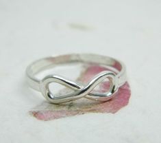 FOREVER RINGDelicate sterling silver INFINITY ringThe ring is made of solid sterling silver 925 with a shiny finish.This ring can be wear as a staking ring.The width is 5 mm at The top, and 2.5 mm at the bottom.The ring can be ordered in U.S. sizes 7-9. Please choice your size at check our page.*If you need it a different size please convo with me first. Sterling Silver Infinity Promise Ring, Sterling Silver Infinity Ring Gift, Sterling Silver Infinity Ring, Dainty Silver Ring, Silver Infinity Ring, Birthday Gift For Girlfriend, Wide Silver Ring, Forever Rings, Vintage Gold Rings