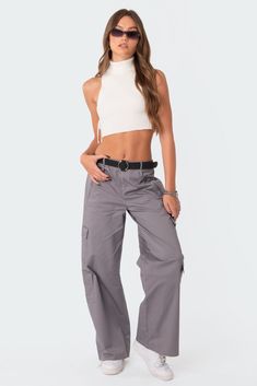 Cargo pants Military style pockets Double belt loops Cotton, Spandex Model wears size S Model height is 5'8 Item care: Wash with similar color Best Cargo Pants, Gray Cargo Pants, Converse Outfits, 2024 Wishlist, Grey Cargo Pants, Double Belt, Flare Jumpsuit, Ribbed Turtleneck Sweater, Outfits With Converse