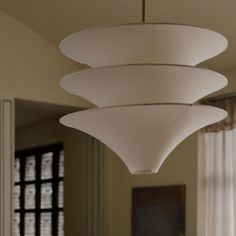 a light fixture hanging from the ceiling in a room