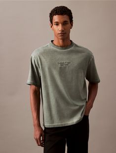 Crafted from 100% cotton, this t-shirt is soft and breathable, perfect for everyday wear. Styled with short sleeves and a crewneck. Cut in a relaxed fit and features a logo graphic at the front.  Material: 100% Cotton. A Logo, Logo Graphic, Calvin Klein, Everyday Wear, Short Sleeves, Dye, Relaxed Fit, Crew Neck, ? Logo