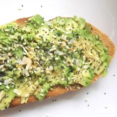 a piece of bread topped with broccoli and sprinkles on it