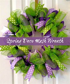 a green wreath with purple and white polka dots