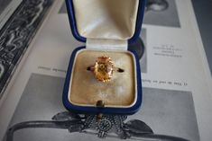 Vintage circa 1980 ring in 18-carat yellow gold. It features an oval citrine of approximately 3.5 carats (13 x 9 x 6 mm). Weight: 4.9g Size: 51 FR (5.75 US - L UK) - Resizing offered Metal: 18 carat gold Stone: Citrine Citrine Weight: approx. 3.5 carats Hallmark: Eagle's head (18 carat gold) Top: 15 x 12 mm Birthday Stone, Woman Ring, Estate Rings, Yellow Rings, Vintage Woman, Vintage Style Rings, Birthday Ring, Ring Fashion, Citrine Ring