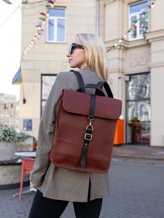 This women's city backpack is a perfect blend of practicality and style, designed to keep up with a busy urban lifestyle. This leather laptop rucksack offers ample space and secure compartments, making it ideal for daily commutes or study sessions as a reliable college backpack. With its sleek silhouette and clean lines, this minimalist city haversack effortlessly combines functionality and elegance.  Material: genuine leather Size: 15,4 x 101,8 x 3,9 inches / 39 x 30 x 10 cm Insidethere is a laptop pocket made of soft fabric with felt: 13,4 x 9,4 x 0,6 inches / 34 x 24 x 1,5 cm The laptop compartment has a pocket: 3,9 x 7,1 inches / 10 x 18 cm Shoulder straps are adjustable: 22,8-37,4 inches / 58-95 cm Processing time: 3-5 business days Delivery time: 7-21 business days - This backpack wi Leather Commuting Backpack With Laptop Sleeve, Everyday Brown Leather Backpack With Laptop Sleeve, Urban Backpack For Daily Use Rectangular, Urban Rectangular Backpack For Daily Use, Rectangular Backpack With Leather Handles For Commuting, Modern Brown Backpack For Commuting, Rectangular Commuting Backpack With Leather Handles, Leather Backpack With Laptop Sleeve For Commuting, Everyday Leather Backpack With Laptop Sleeve