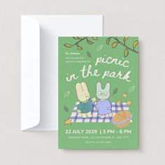 a card with the words picnic in the park on it and an image of two rabbits sitting